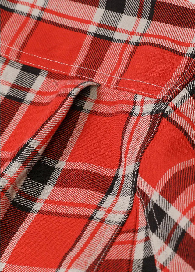 Close-up of pleats of watermelon red men's workwear cotton shirt