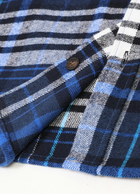 Close-up of the hem of royal blue men's heavyweight flannel shirt