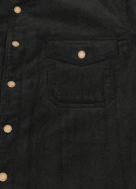 Detailed view of black men's corduroy shirt jacket pocket with button