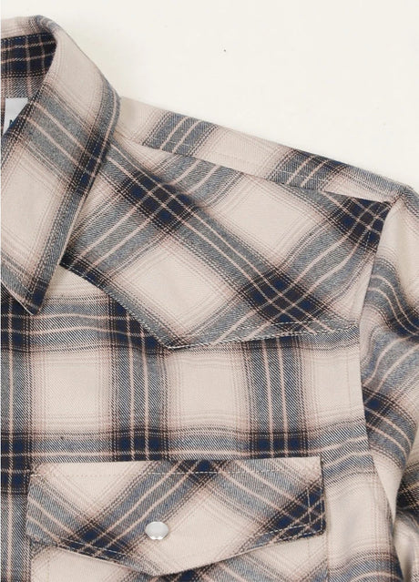 Close-up of the shoulder of sandy azure men's plaid long sleeve western shirt