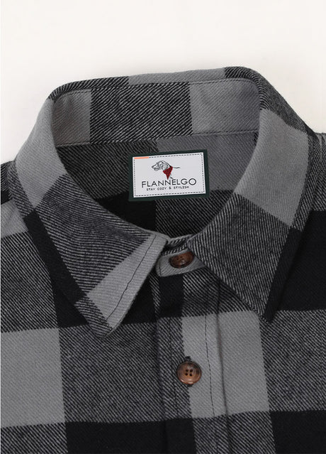 Close-up of the lapel of gray men's warm rugged stiff flannel plaid shirt