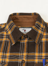 Close-up of the lapel of autumn gold men's rugged ridge suede flannel shirt 