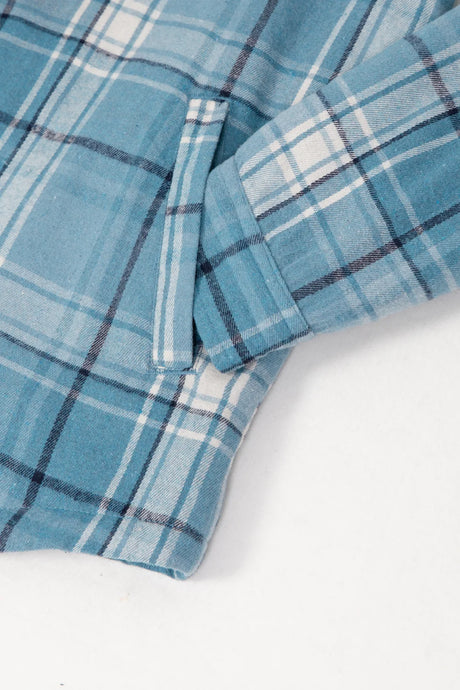 Detailed view of the hand pocket of sky blue men's sherpa lined flannel plaid jacket