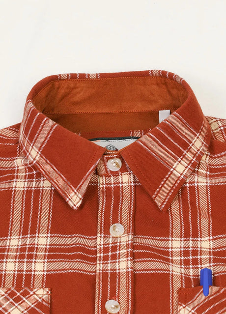 Close-up of the lapel of rust red men's rugged ridge suede flannel shirt 