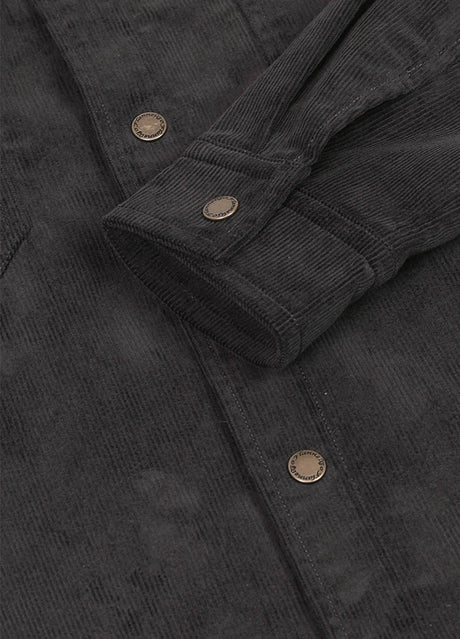 Detailed view of men's charcoa corduroy shirt jacket cuff with button