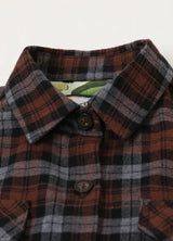 Detail of buttoned front closure on kids wildlife adventure flannel plaid shirt