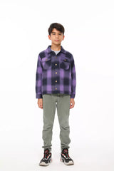 A standing boy in purple flannel shacket