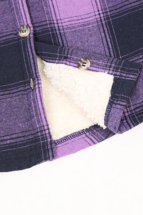 Detail of buttons on girls purple flannel jacket 