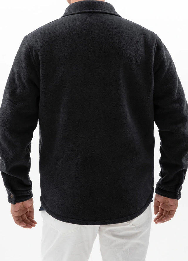 Back view of a man in a twill black men's winter sherpa fleece lined shacket 