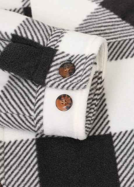 Close-up of the cuff of buffalo black white men's sherpa lined shirt jacket with button closure