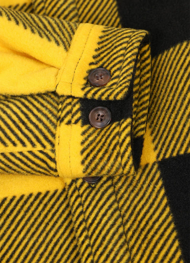 Close-up of the cuff of buffalo yellow black men's sherpa lined shirt jacket with button closure