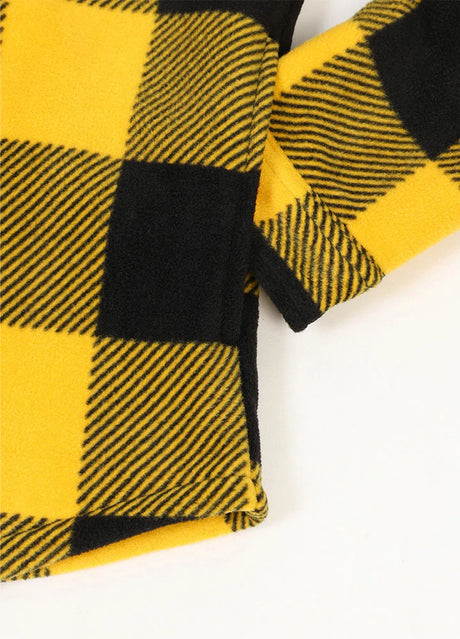 Close-up of the seam pocket of buffalo yellow black men's sherpa lined plaid shirt jacket with button closure