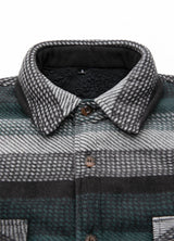 Close-up of the lapel of green stripe men's button plaid shirt jacket with sherpa lining