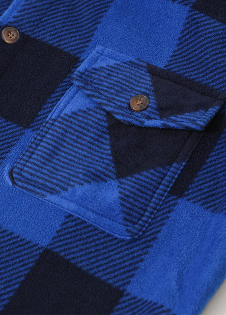 Close-up of the pocket of buffalo blue black men's winter button closure shirt jacket