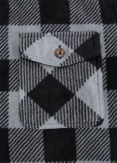 Close-up of the pocket of grey men's winter button closure shirt jacket