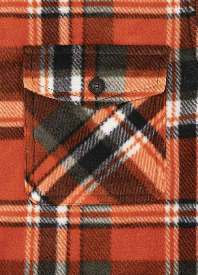 Close-up of the pocket of orange plaid men's winter button closure shirt jacket