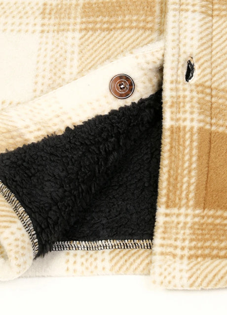 Close-up of the hem of desert ivory cozy sherpa lined shacket with chest pockets