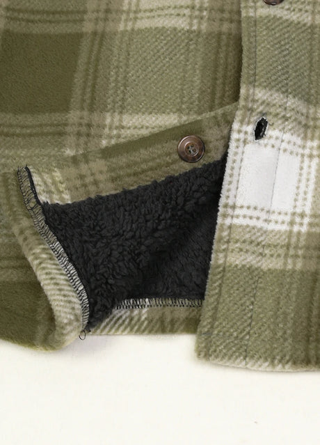 Close-up of the hem of misty woodland cozy sherpa lined shacket with chest pockets