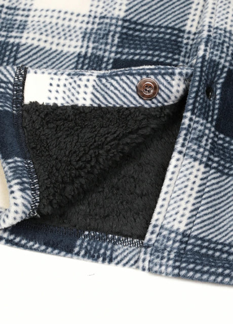 Close-up of the hem of ocean breeze tartan men's seam pockets sherpa lined shirt jacket