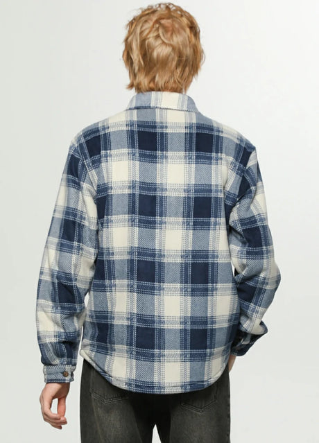 Back view of a man wearing an ocean breeze tartan men's sherpa lined durable plaid jacket 