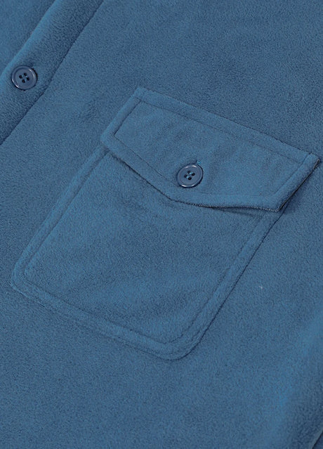 Close-up of the pocket of light blue men's winter sherpa fleece lined shacket 