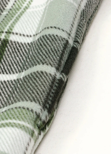 Close-up of the seam pocket of midnight dawn sherpa lined plaid shacket for men