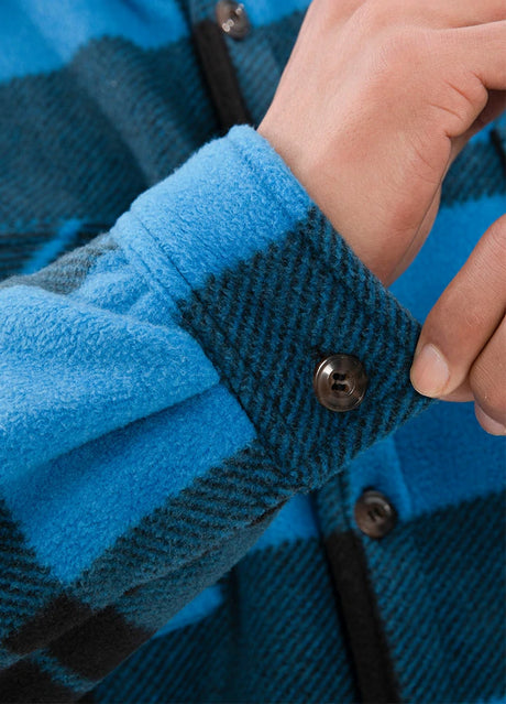 Detailed view of the cuff of blue black sherpa lined plaid shirt jacket for men