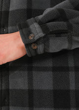 Close-up of the cuff of grey sherpa lined plaid shirt jacket for men