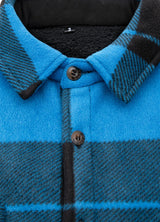 Close-up of the lapel of blue black men's button plaid shirt jacket with sherpa lining