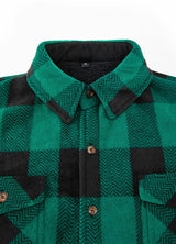 Close-up of the lapel of green men's button plaid shirt jacket with sherpa lining