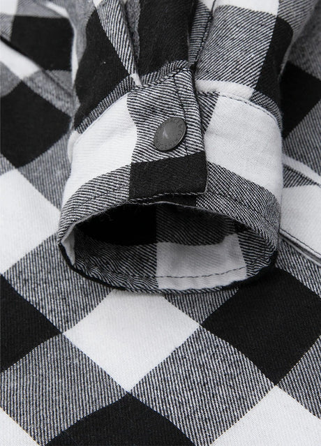 Close-up of cuff of black white plaid men's hooded flannel jacket with quilted lining