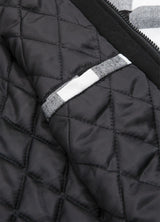 Close-up of the inner pocket of black white plaid men's thicken flannel hoodie with quilted lining