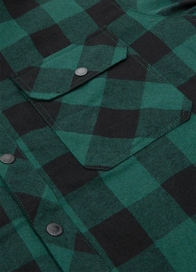 Close-up of the pocket of green buffalo plaid men's quilted lined plaid flannel shirt jacket