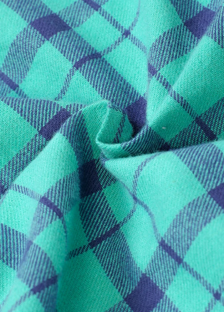 Detailed close-up of cozy fabric on kid's turquoise long-sleeve western shirt