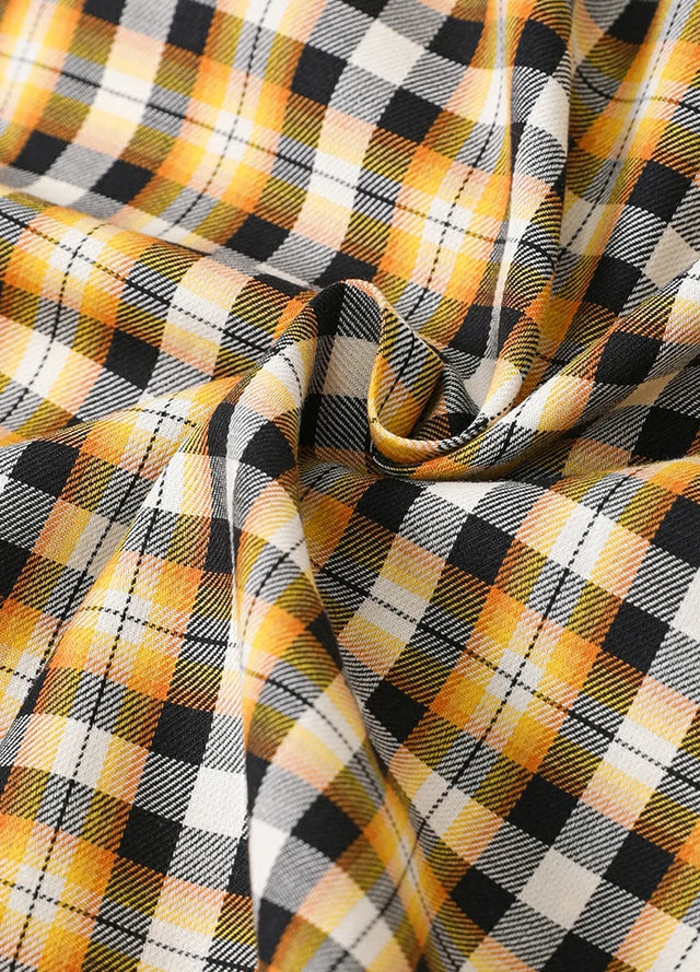 Detailed view of the fabric of bumblebee short sleeve plaid shirt for men