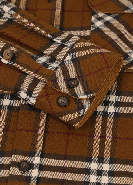 Close-up of the cuff of brown men's cozy midweight flannel shirt 