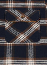 Close-up of the pocket of navy coffee men's midweight plaid flannel shirt