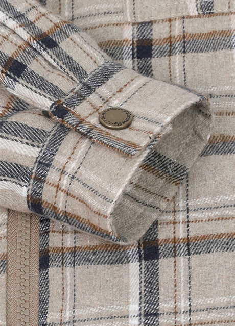 Detaied view of kid's dusk flannel jacket cuffs with snap button