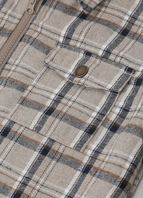 Detailed view of pocket with button on dusk flannel jacket for kids