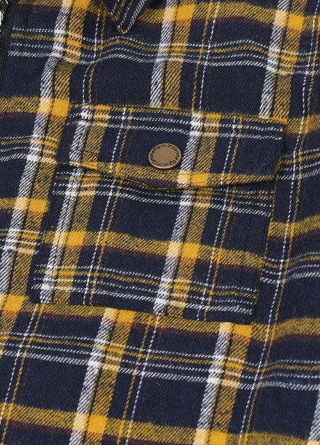 Detailed view of pocket with button on kid's navy gold flannel jacket