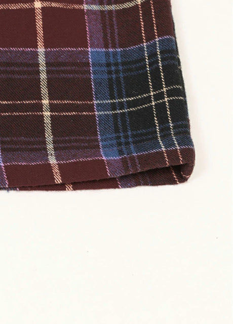 Close-up of the hem of the men's cozy raspberry blue zipper plaid jacket