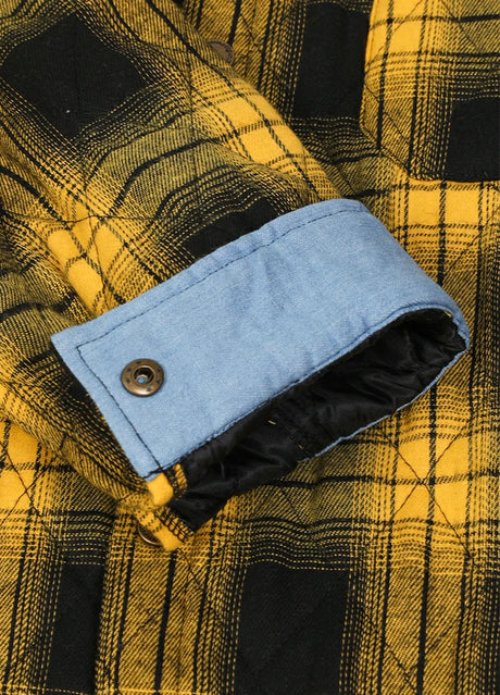 Detailed view of roll up cuff of bold yellow men's quilted lined plaid shacket