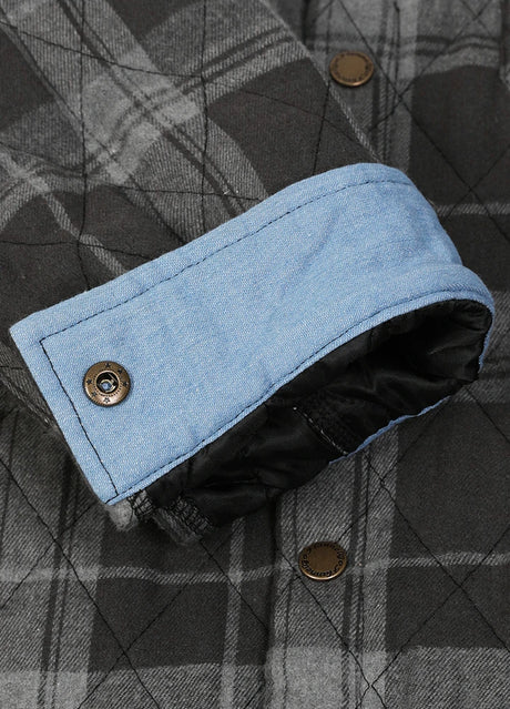 Close-up of the roll up cuff of charcoal haze men's quilted lined plaid shacket