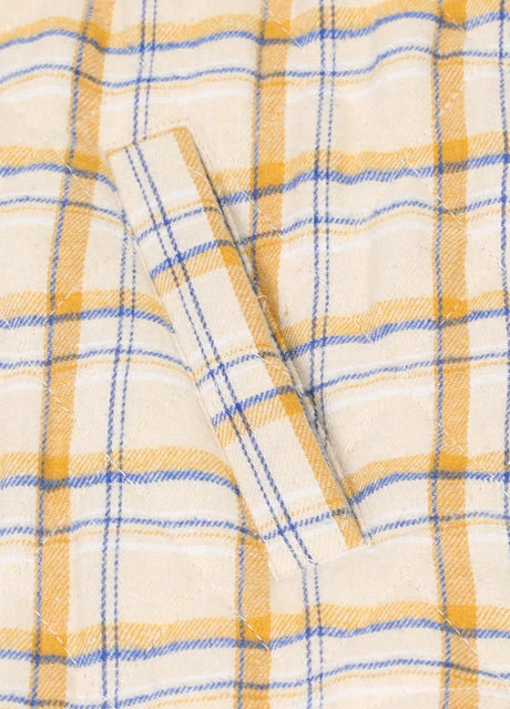 Close-up of the hand pocket of khaki men's plaid shirt jacket with quilted lining