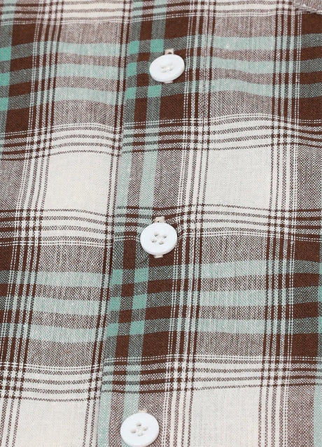 Close-up of buttons detail on kids flannel short sleeve shirt