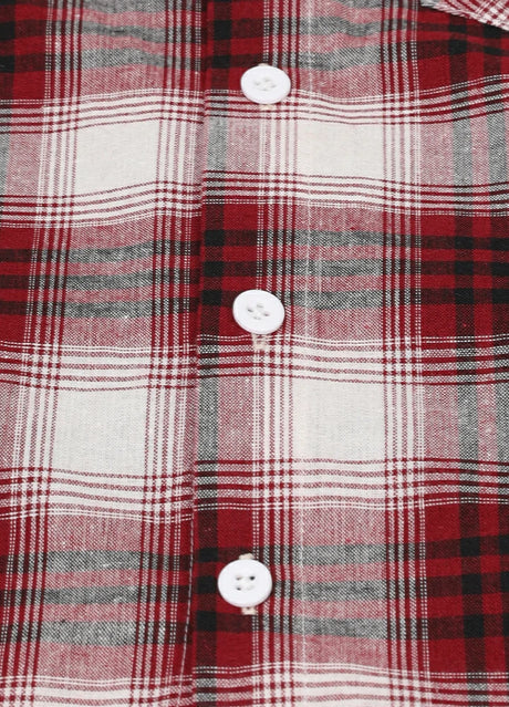 Detail of the buttons on kids soft flannel short sleeve shirt