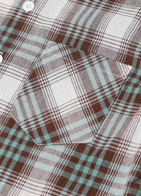 Detail of pocket detail on a button-up short sleeve shirt for kids