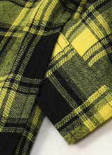 Close-up of boys mango yellow flannel jacket exterior fabric