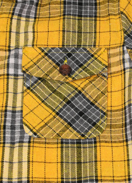 Close-up of boys light yellow flannel jacket with pocket