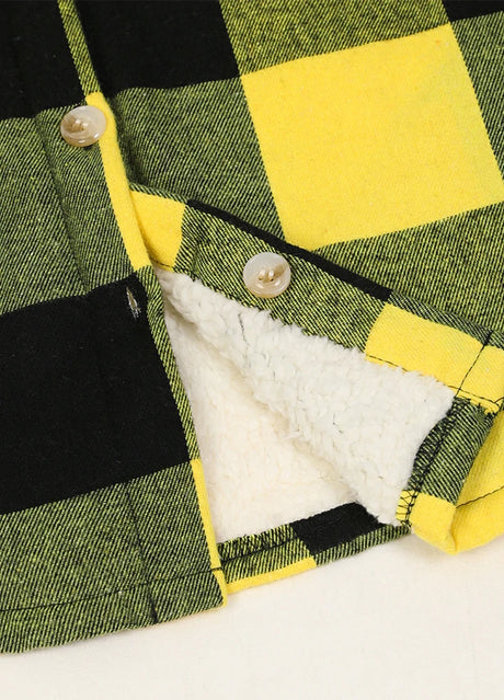 Detailed view of boys yellow black flannel jacket hem